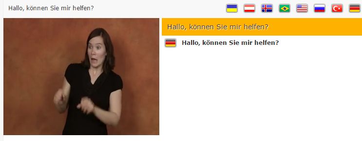 Screenshot von Spread Signs: Frau gebärdet "Hallo, können Sie mir helfen?"